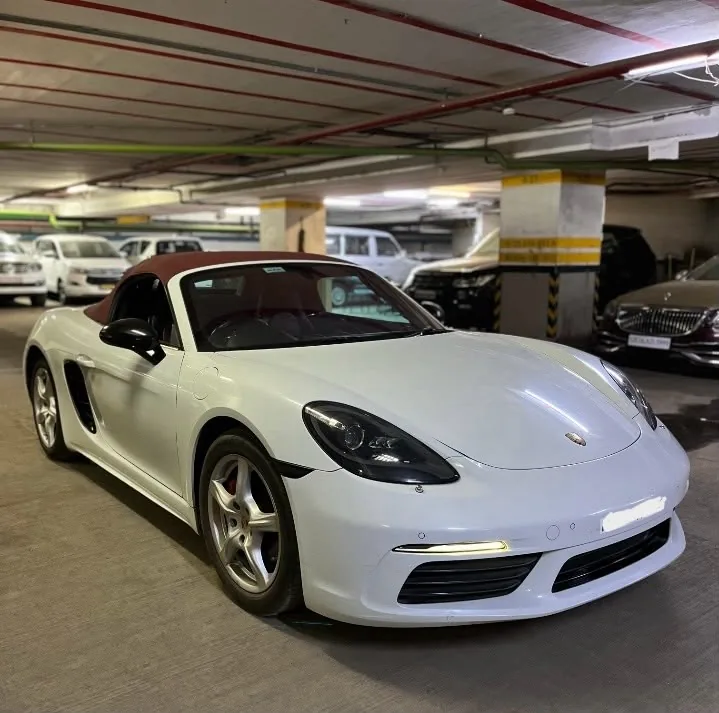 Porsche 718 Boxster chauffeur-driven hire Mumbai - The Concoerge DMC